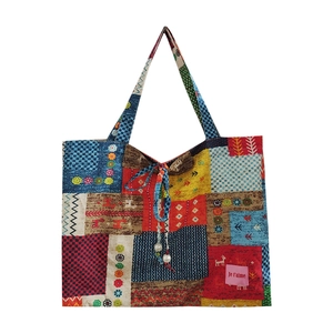Grand sac cabas ethnique en patchwork avec cordon de serrage et motifs géométriques