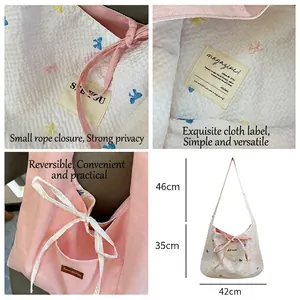 Sac fourre-tout réversible rose à carreaux avec fermeture à cordon coulissant