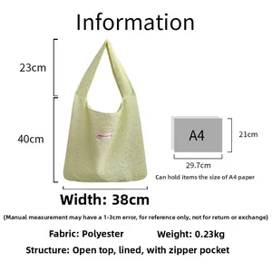 Detail view of yellow textured bubble tote bag with A4 size comparison and dimensions