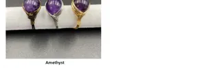 Detail view of handmade amethyst wire wrapped rings in gold silver and bronze metal finishes