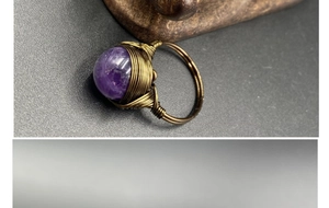 Detailed view of handmade wire-wrapped amethyst ring with vintage bohemian copper design