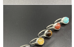 Handcrafted silver wire-wrapped ring set featuring turquoise, agate, and tiger eye stones
