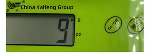 Gros plan sur la balance de cuisine numérique verte avec écran LCD et unités g/oz