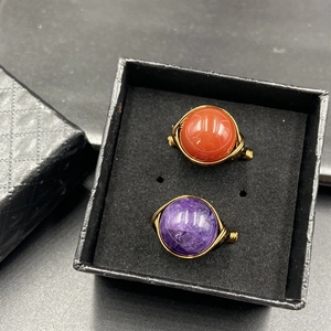 Handmade wire-wrapped rings with lapis lazuli and amethyst beads in a black gift box
