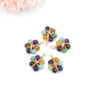 Star-shaped wire wrapped natural stone pendant with colorful beads and gold wiring
