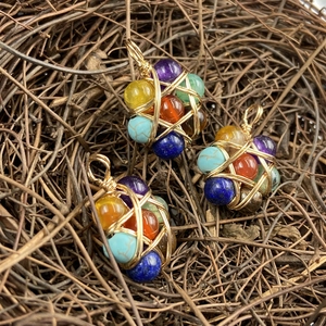 Handmade wire wrapped hexagram pendant with seven chakra natural stones and gold metal wire
