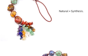 Close-up of handmade chakra stones pendant with woven brown wax cord and healing crystals