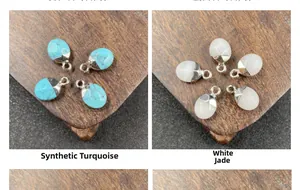 Detalle de colgantes de lágrima tallados en turquesa sintética y jade blanco