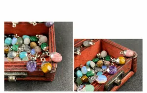 Detalle de colgantes de piedras semipreciosas en un joyero de madera antiguo
