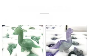 Macro detail of hand-carved dinosaur gemstone figures in Green Aventurine and Phosphosiderite