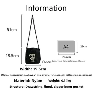 Detailed size specifications of the embroidered nylon drawstring crossbody bag in black