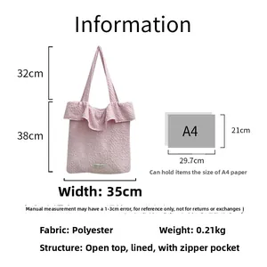 Pink ruffled tote bag detail showing polyester texture, open top, and interior zipper pocket