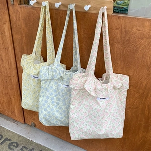 Floral canvas tote bags with ruffle edges in yellow blue and pink for daily use