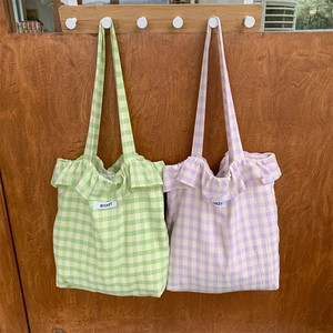 Floral plaid tote bag with ruffle trim and Bisket label in green and purple hues