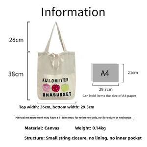 Detailed view of canvas tote bag with apple print and cord closure dimensions