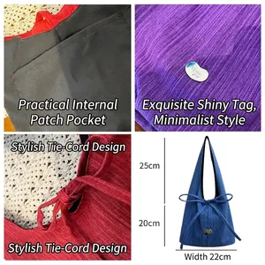 Vertical striped denim tote bag in four colors with heart emblem and bow details
