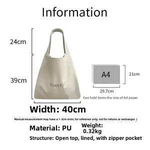 Detail view of cream PU leather tote bag with Hooray text and interior zipper pocket