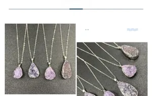 Detailed view of natural amethyst crystal clusters with silver plated edges on necklaces