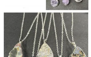 Macro detail of natural raw amethyst crystal pendants with silver-plated metal edges