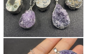 Macro detail of natural amethyst geode pendant with silver plated edge and fine chain