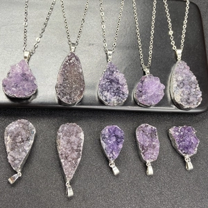 Natural druzy amethyst crystal pendant with silver electroplated edges on a chain