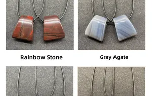 Detail of fan-shaped natural rainbow stone and grey agate pendants with hanging cords
