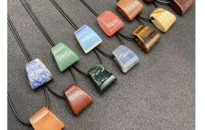 Polished natural agate stone trapezoid pendants in various colors with black cord necklaces