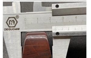Detail showing measurement of the red agate pendant width at 21mm with a digital caliper
