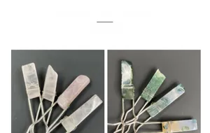 Detail of handmade wire-wrapped hair sticks with raw amethyst and agate stones