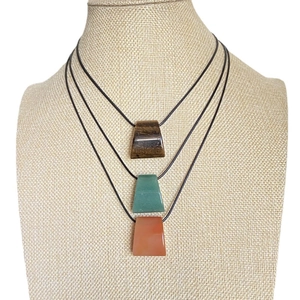 Trapezoidal natural stone pendants with tiger eye and aventurine on woven necklaces