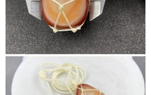 Detailed caliper measurement showing thickness of red agate stone mesh necklace