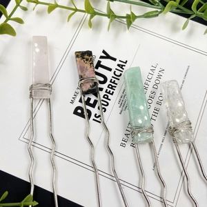 Set of four natural gemstone hair pins featuring wire-wrapped raw stones on U-shaped metal clips