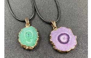 Detail of colorful crystal sunflower pendants with electroplated gold edges and cords