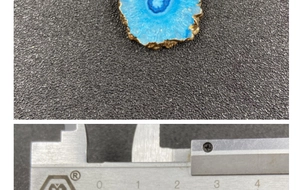 Detail showing blue agate slice pendant with gold plating measured with a caliper