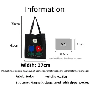 Detail view of nylon tote bag with tulip embroidery and dimensions of 37x41 cm
