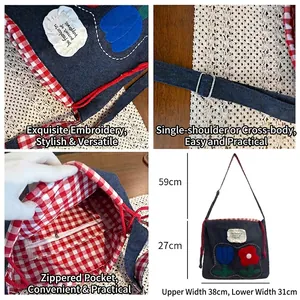 Floral embroidered navy nylon tote bag with adjustable strap and internal zipper pocket