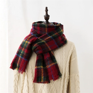 Classic red plaid scarf with tassels on a mannequin, soft warm winter cashmere feel