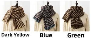 Detailed close-up of colorful houndstooth scarves with tassel fringe in three colors