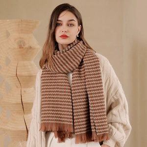 Thick warm checkered scarf with orange brown houndstooth pattern and fringe trim