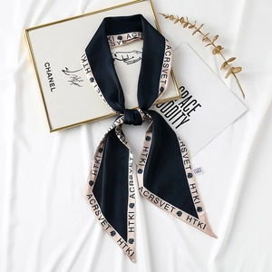 Retro silk twilly scarf with blue floral print and lettering on a satin texture