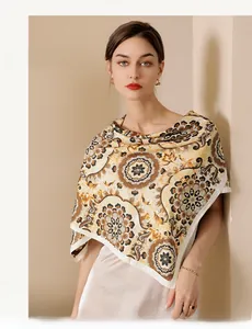 Detailed view of the luxury floral pattern and silky texture of the yellow satin scarf