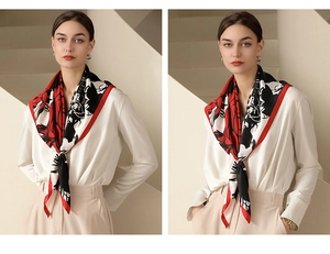 Detail view of large floral print faux silk scarf tied elegantly around neck area