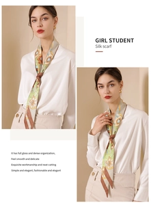 Detail of floral silk scarf with glossy satin finish shown as an elegant neck tie knot