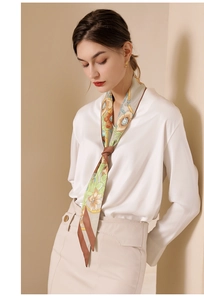 Floral print long silk scarf styled with white shirt on model for elegant fashion look