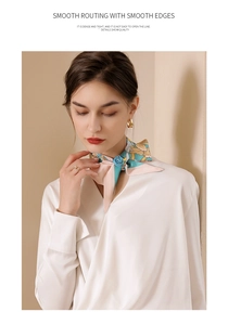 Detail of silk scarf with smooth routing edges and elegant floral print patterns