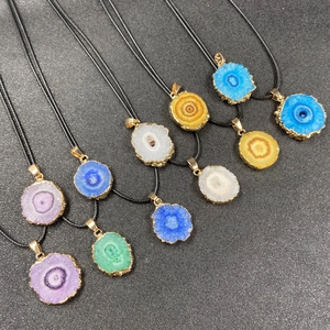 Colorful druzy agate slice pendants with gold plated edges and black cord necklaces