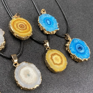 Colorful geode slice sunflower necklace with gold-plated edges and black cord chain