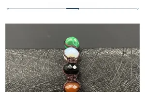 Macro detail of hand-woven bracelet with colorful natural crystal and gemstone beads