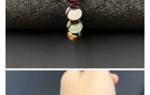 Macro detail of natural multicolored crystal stones woven on a brown braided bracelet
