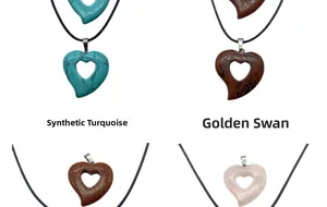 Macro detail of hollow heart-shaped stone pendants in turquoise, quartz, and goldstone